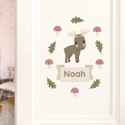 Door decorated with a name sign reading “Noah”, illustrated with a moose and forest details.