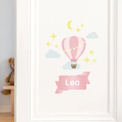 Personalized hot air balloon wall decal for a child's room, featuring the name Lea with stars and clouds, perfect for a playful nursery environment.