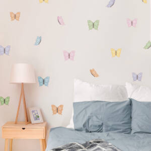 Colorful butterflies in different pastel shades, perfect as wall decals for a kids’ room.