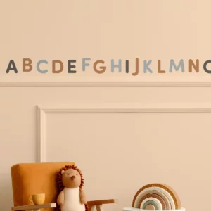 Colorful alphabet wall decals in a children's room, creating an engaging and educational atmosphere, ideal for personalized kids' decor. Perfect for enhancing playroom aesthetics and promoting early literacy.
