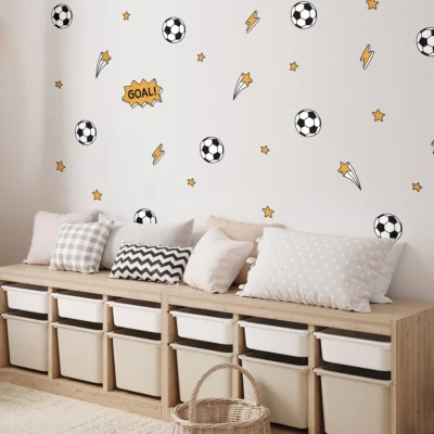 Soccer wall decals for kids featuring balls, stars, and “GOAL!” text on a white background—fun decor for bedroom or playroom.